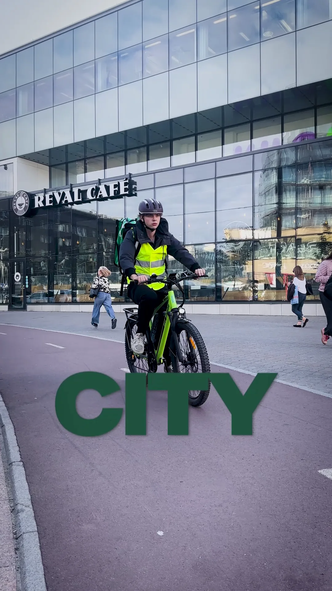 EasyRide courier riding through central Tallinn