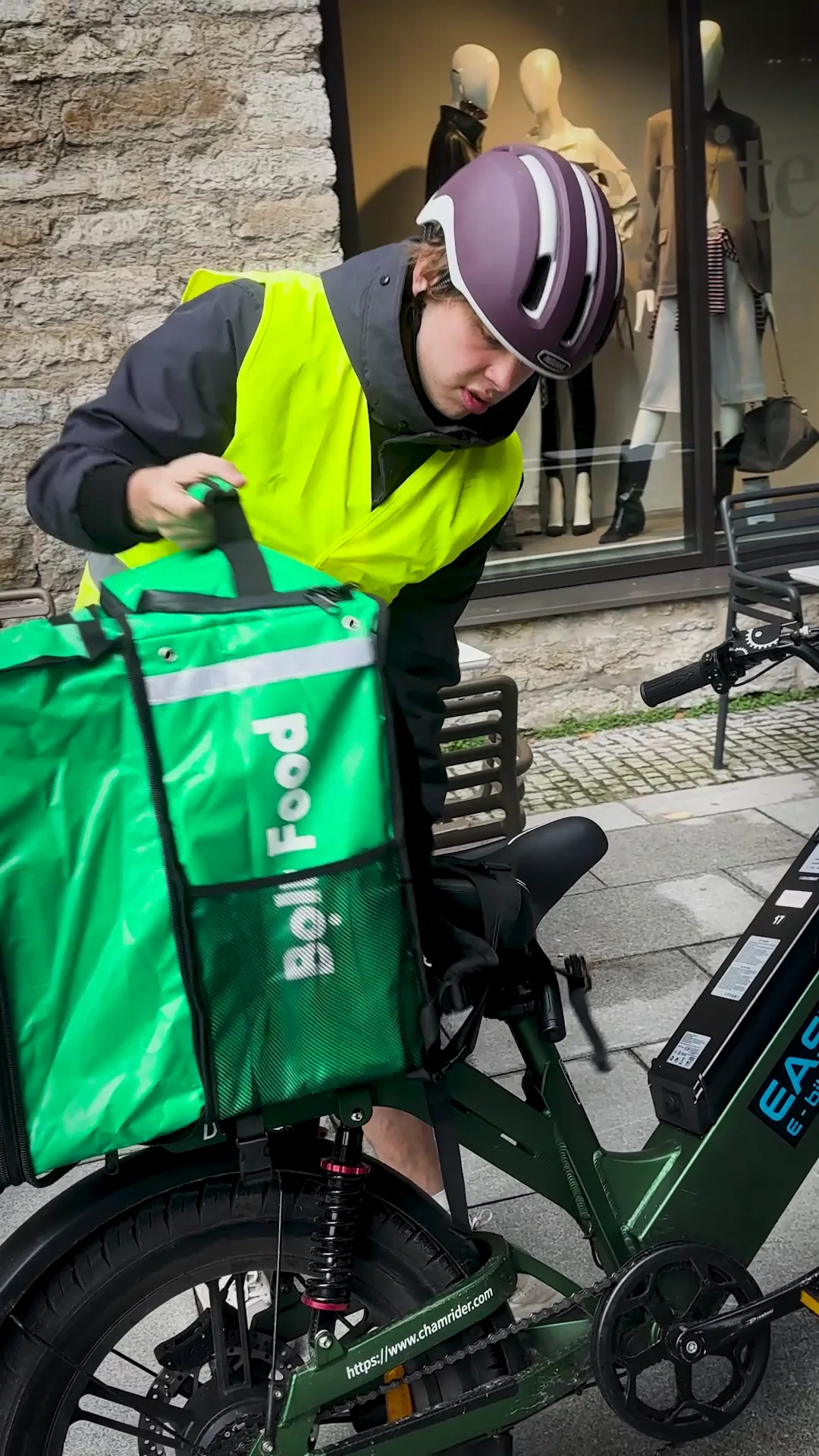 EasyRide rider securing a delivery bag before a route